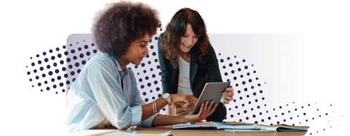 Two women looking at a tablet device 